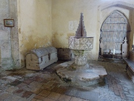 The font and parish chest in Thompson Church. 