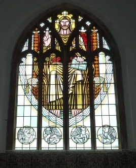 Stained glass in Toft Monks Church. 