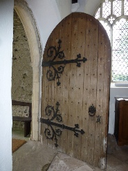 The wooden doorway into St Margaret's Church. 