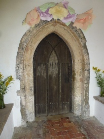 The arched doorway of the church at Toft Monks.