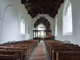 View of the aisle and altar in Briston. 